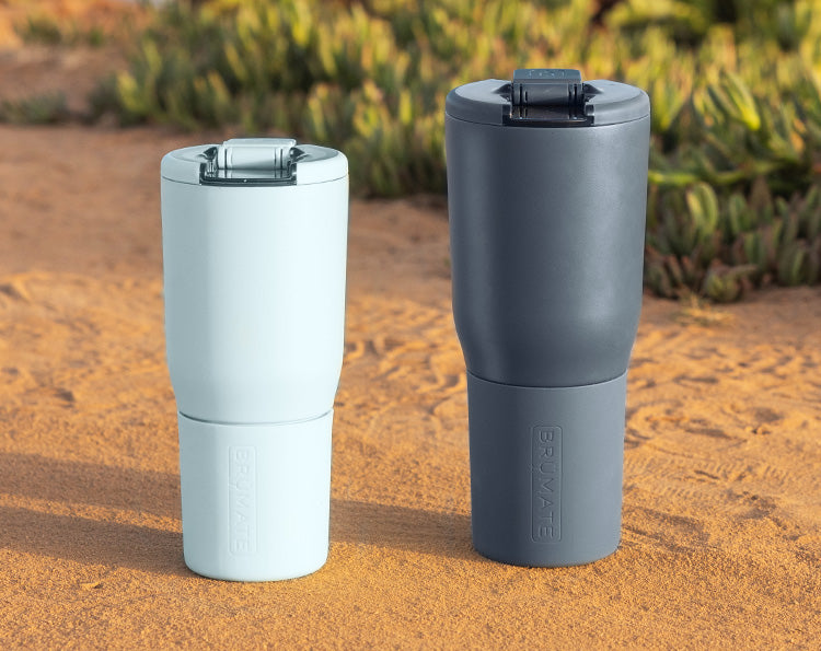 Nav drinkware sitting in the sand